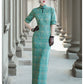 Tailoring a modern blue-green qipao gown for you.