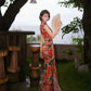 Modern qipao gown with red floral patterns