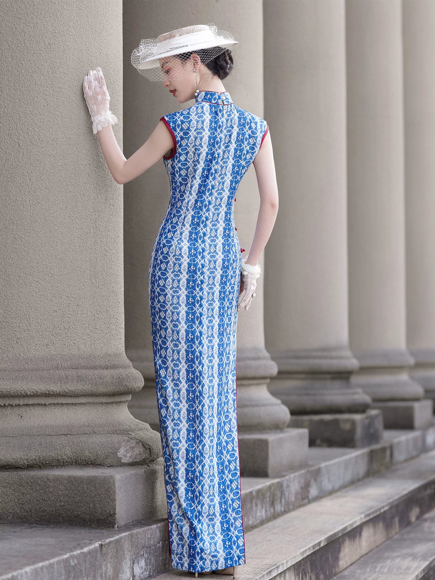 Blue sleeveless full-length qipao gown