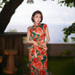 Modern qipao gown with red floral patterns