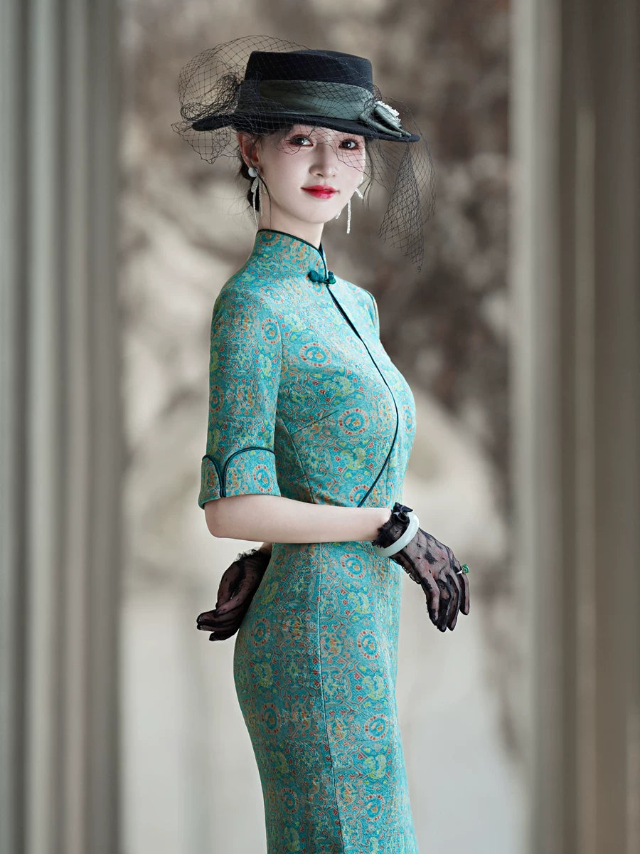 Tailoring a modern blue-green qipao gown for you.