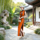 Orange sleeveless modern qipao gown