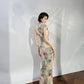 A cyan floral qipao gown for summer.