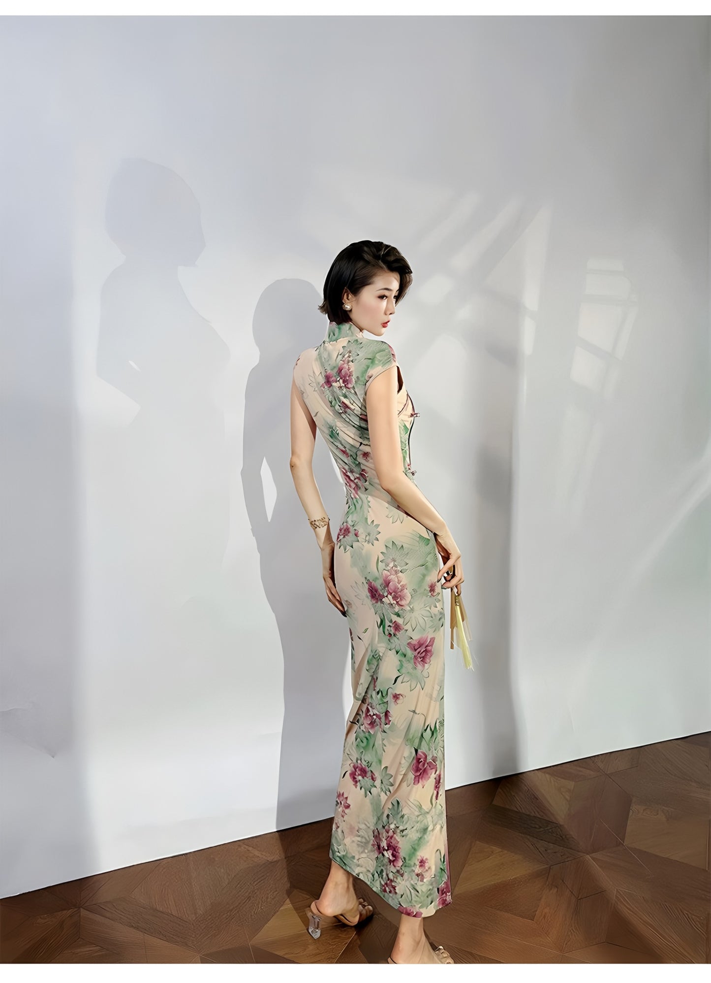 A cyan floral qipao gown for summer.