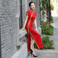 Traditional red qipao gown for the tea ceremony.