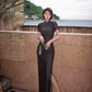 Modern qipao gown with a black plaid print.