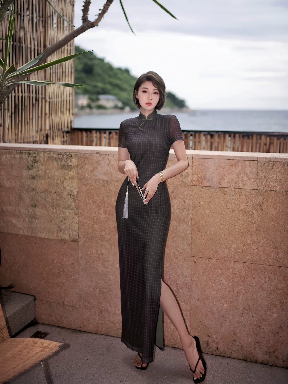 Modern qipao gown with a black plaid print.