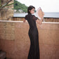 Modern qipao gown with a black plaid print.