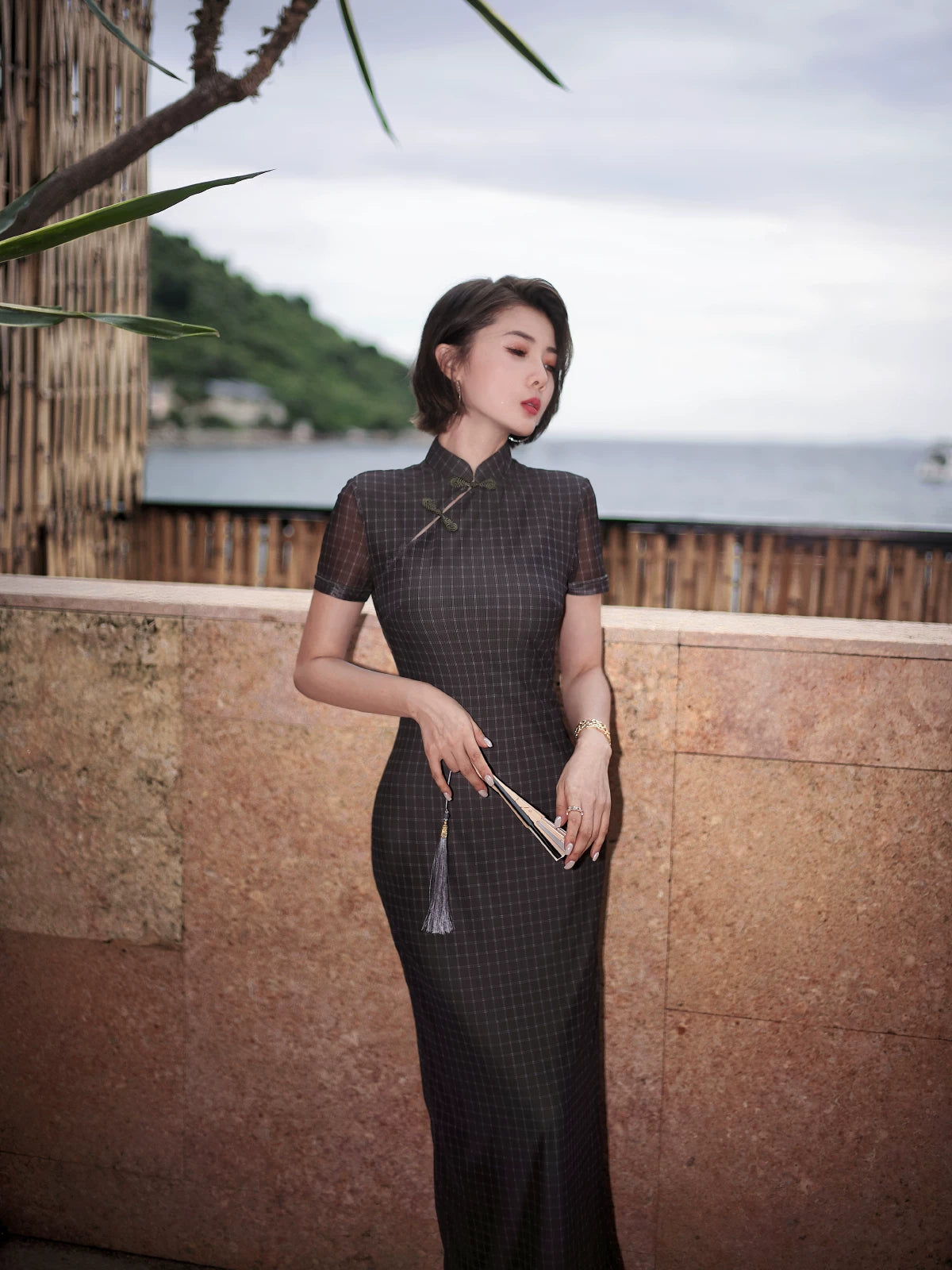 Modern qipao gown with a black plaid print.