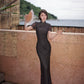 Modern qipao gown with a black plaid print.