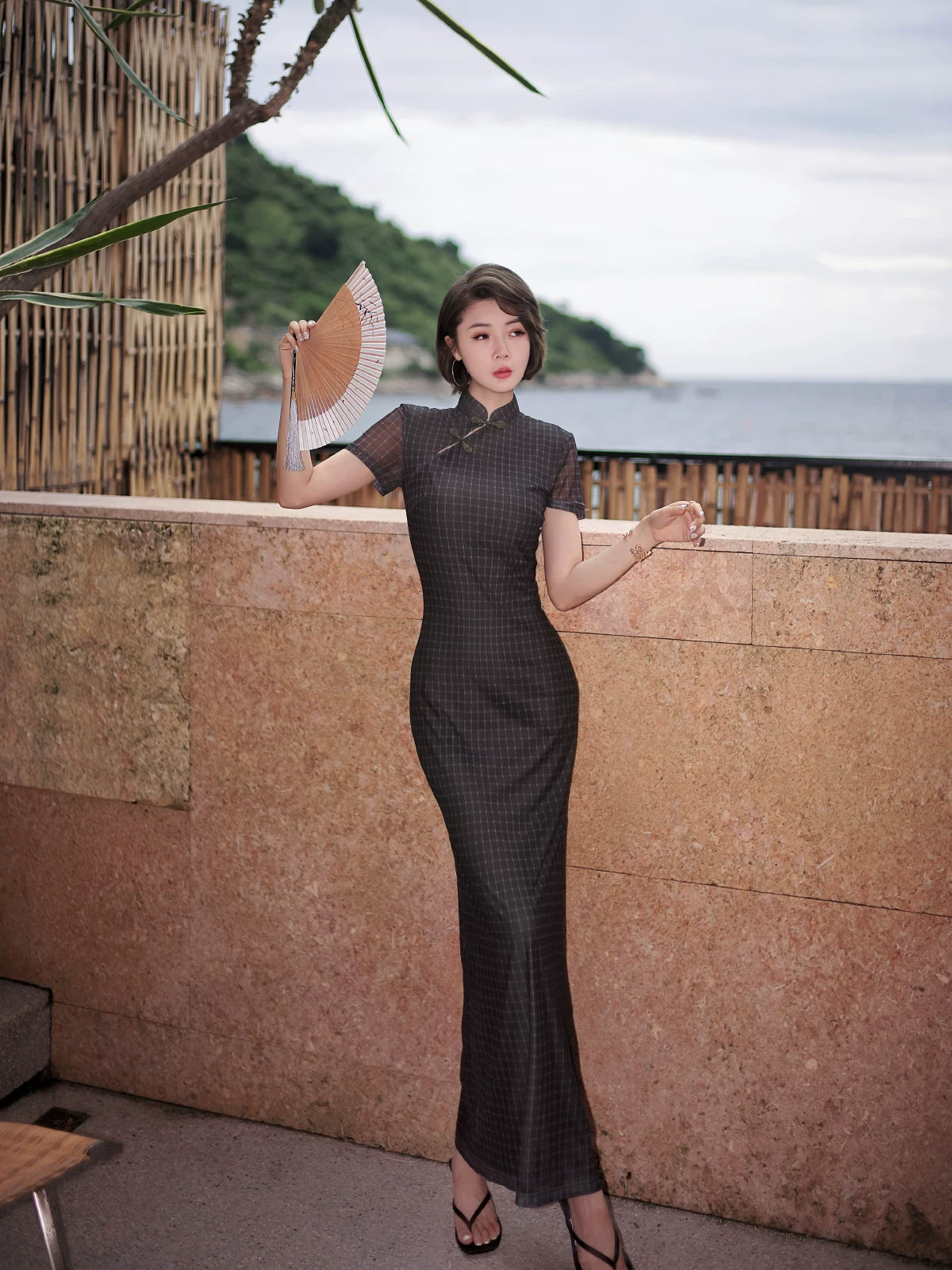 Modern qipao gown with a black plaid print.