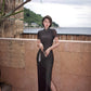 Modern qipao gown with a black plaid print.