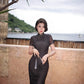 Modern qipao gown with a black plaid print.