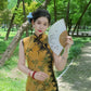 Yellow sleeveless modern qipao with a bamboo print.