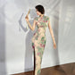 A cyan floral qipao gown for summer.