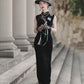 Sleeveless black velvet modern qipao featuring lotus embroidery.