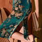 Green knee-length cheongsam dress. Fully lined. Polyester and silk blend.
