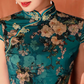 Green knee-length cheongsam dress. Fully lined. Polyester and silk blend.